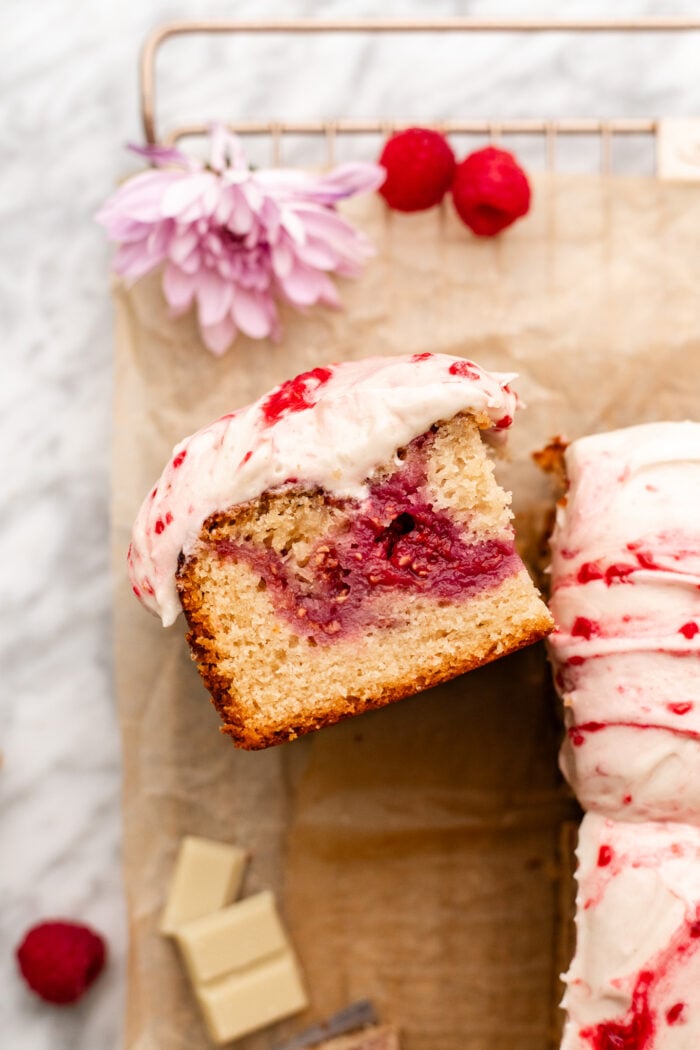 raspberry white chocolate cake slice on parchment paper
