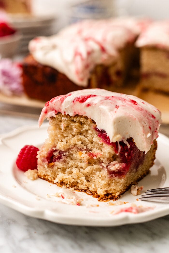 bitten slice of raspberry white chocolate cake