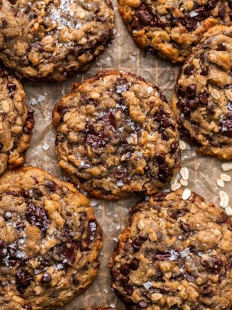 brown butter oatmeal chocolate chip cookies on parchment paper